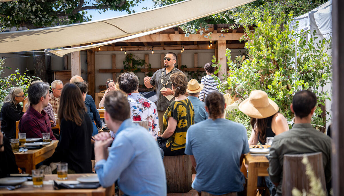 Vincent Medina speaks during a meal at ‘oṭṭoytak, meaning “the Place of Repair,” on the patio next to the Hearst Museum.